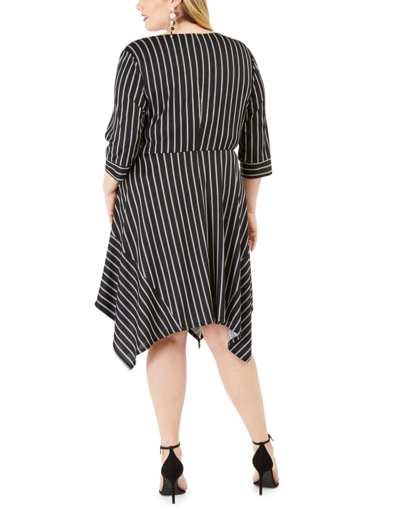 Back of a model wearing a size 2X Love Squared Women's Trendy Plus Handkerchief-Hem Wrap Dress Black Size 2X in Black by Love Squared. | dia_product_style_image_id:313433